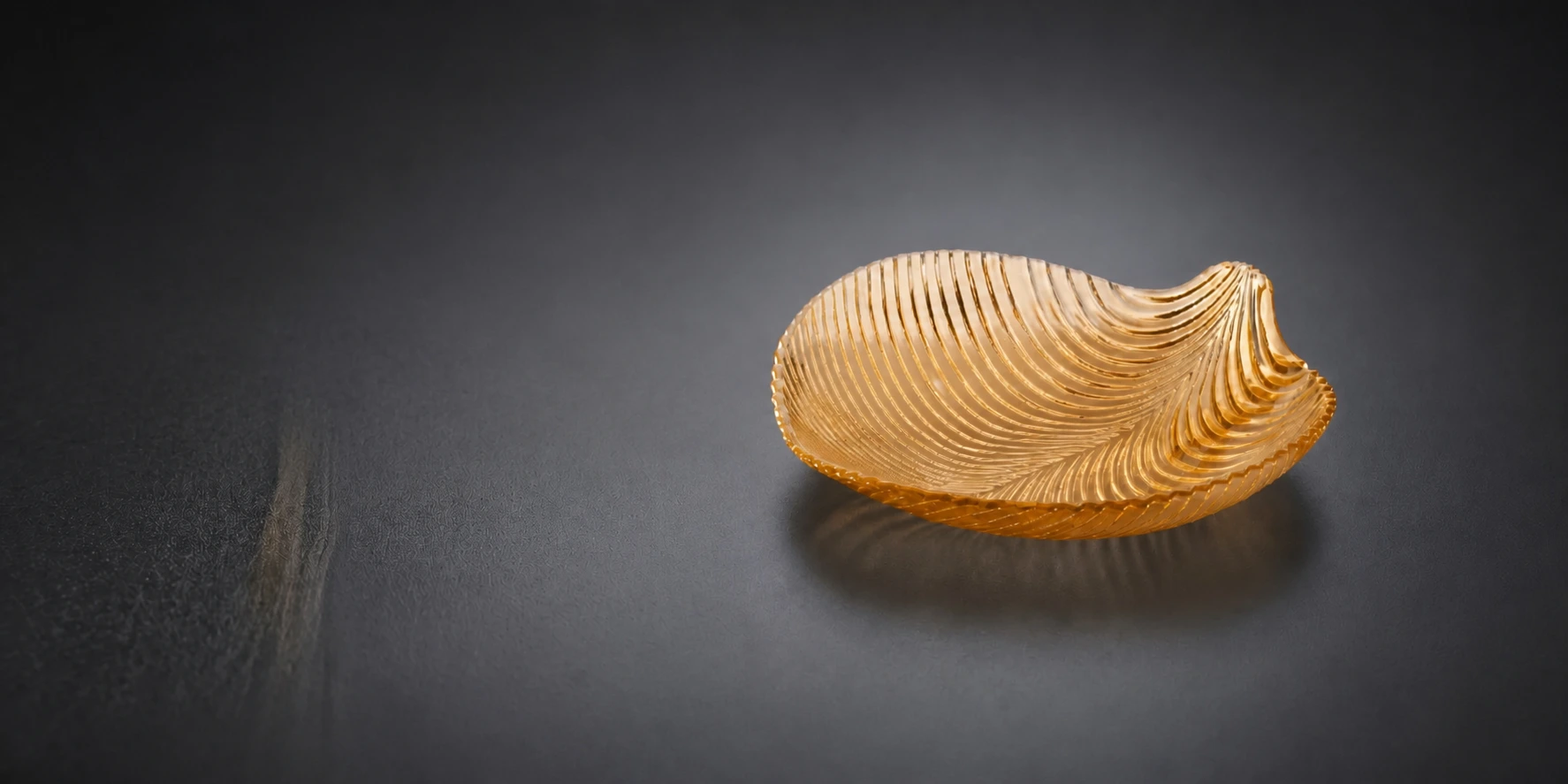 Amber pressed-glass leaf serving plate manufactured by HangoTech