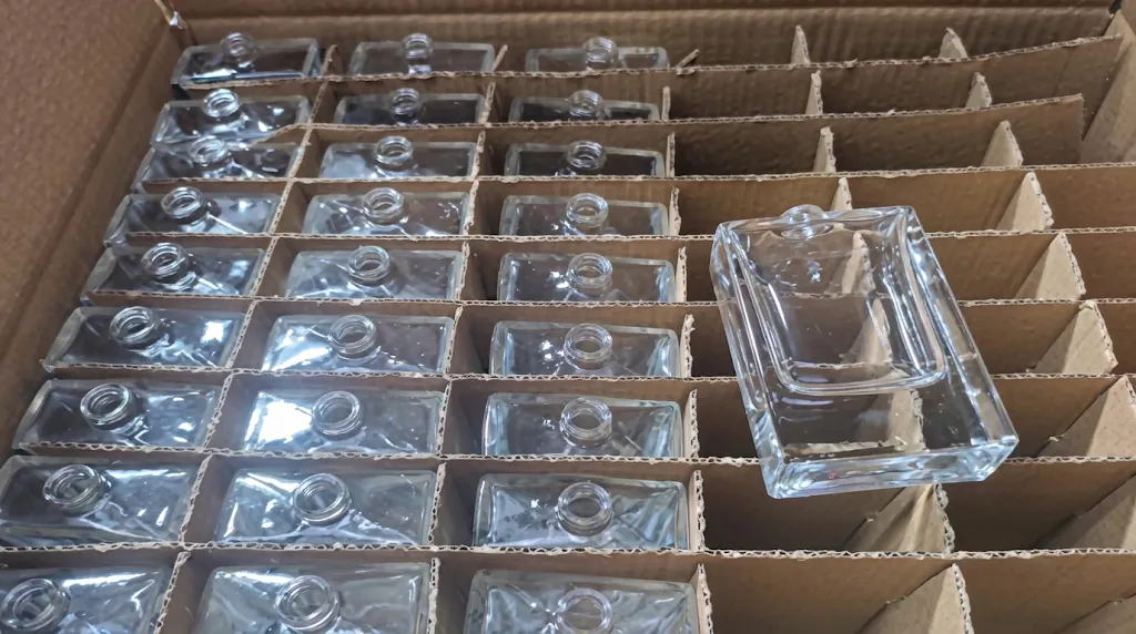 Finished square glass bottles ready for quality review