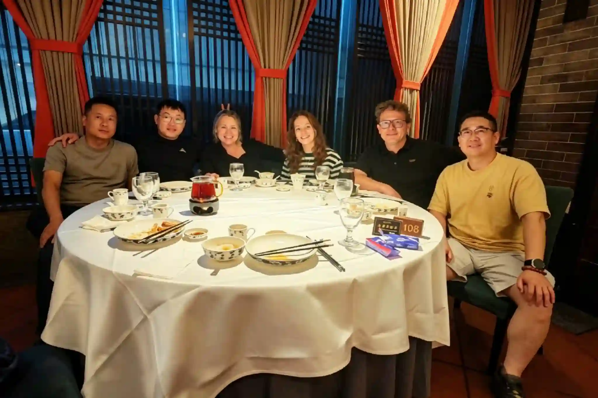 HangoTech team and customers at a restaurant gathering