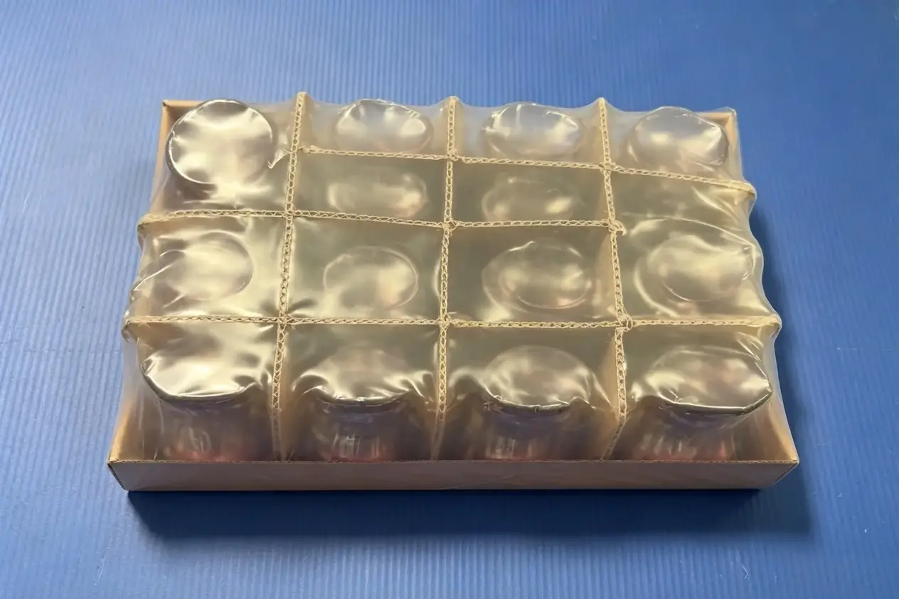 Front-angle view of finished protective glass product packaging